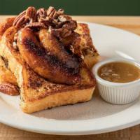 Brioche French Toast · Caramelized bananas, roasted pecans and warm maple butter.