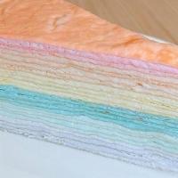 Rainbow Crepe Cake · thin layers of pancakes with whipped cream in between.  this Mille Crepe Cake is not too swe...