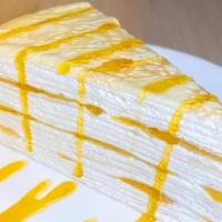 Mango Mille Crepe Cake · thin layers of pancakes with whipped cream in between.  this Mille Crepe Cake is not too swe...