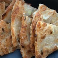 Scallion Pancakes · Crispy, flaky, flatbread with scallions, house made gyoza sauce