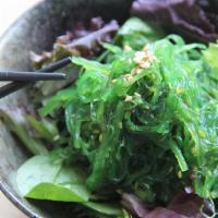 Seaweed Salad · Seaweed salad topped with sesame seeds ***Contains Sesame***