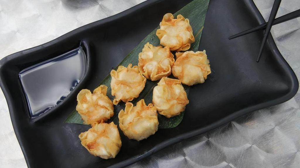 Shumai (Shrimp And Pork) · Fried or steamed shrimp and pork stuffed dumplings with house made gyoza sauce (8 pieces)