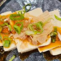 Yakko Tofu · Cold tofu with soy sauce or gluten free soy sauce topped with bonito flakes, scallions, and ...
