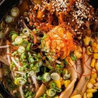 Teriyaki Ton Ramen · Teriyaki flavored shredded chashu, black fungus, bean sprouts, bamboo shoot, corn, green oni...
