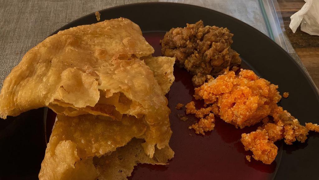 Halwa Puri · Fried crunchy poori and special halwa by our chef with chickpea gravy, aloo bhujia cooked in herbs, and spices.