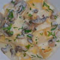 Fresh Handmade Papardelle · Wild mushrooms and creamy truffle oil.