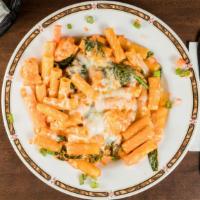 Rigatoni Fiorentina  · Fresh Chicken, Spinach, Mozzarella tossed in a creamy pink sauce served over rigatoni