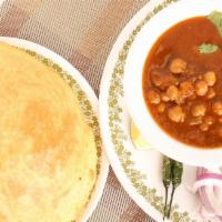 Chole Bhature · Spiced chickpea gravy served with Delhi-style bhatura.
