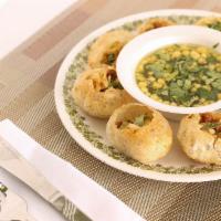 Pani Puri · Consisting of a hollow, crispy-fried puffed ball that is filled with potato, chickpeas, onio...