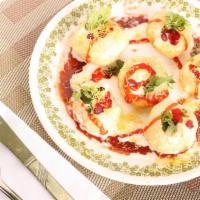 Dahi Puri · Made from deep-fried puris which are stuffed with potatoes, chutneys and then topped with cu...