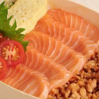 Salmon Don · Fresh salmon, salmon roe, sautéed chopped salmon, egg roll, pickle over Japanese rice.
