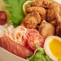 Karaage Bento · Deep-fried chicken, soft boiled egg, kani salad, Japanese Berkshire pork sausage, pickle, pl...