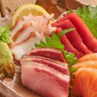 Assorted Sashimi · 12 pieces of chef's selection. Bluefin tuna, salmon, yellowtail, octopus.
