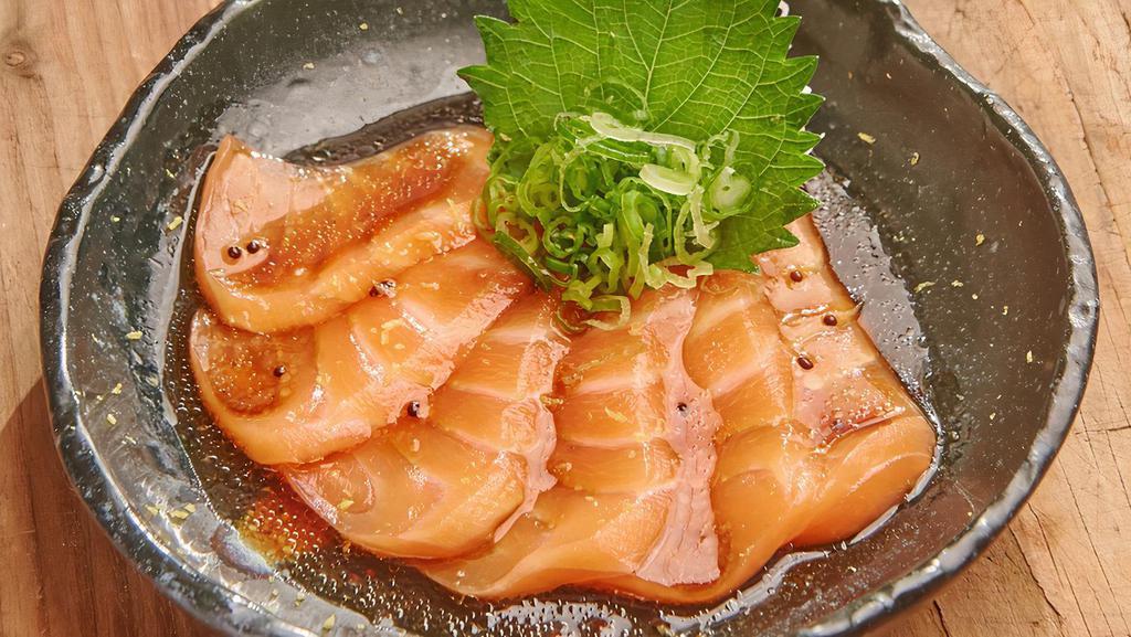 Salmon Carpaccio · Salmon and scallion with wasabi dressing.