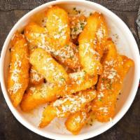 The Great Garlic Parmesan Tenders · Chicken tenders breaded, fried until golden brown before being tossed in garlic parmesan sau...