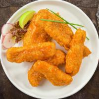 Buffed Buffalo Tenders · Chicken tenders breaded and fried until golden brown before being tossed in buffalo sauce.