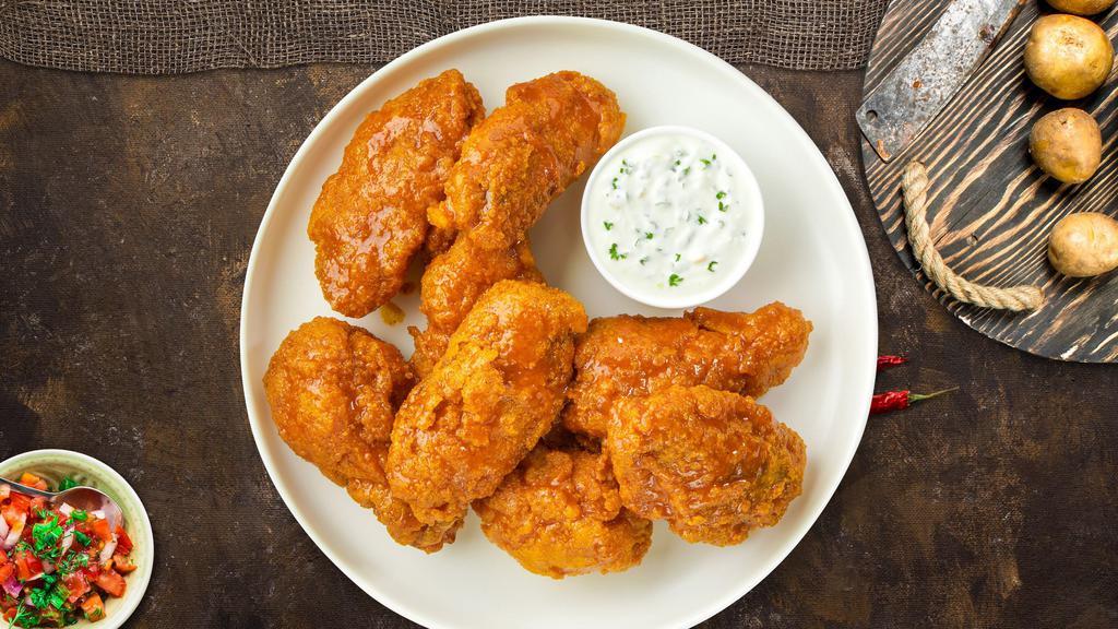 Go Go Mango Habanero Wings · Fresh chicken wings breaded, fried until golden brown, and tossed in mango habanero sauce. Served with a side of ranch or bleu cheese.