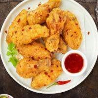 Sweet Chili Of Mine Wings · Fresh chicken wings breaded, fried until golden brown, and tossed in sweet chili sauce. Serv...