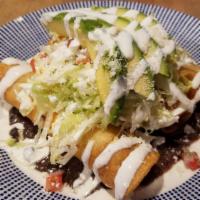 Flautas · 3 hard shell tacos stuffed with cheese, topped with lettuce, pico de gallo,  sour cream and ...