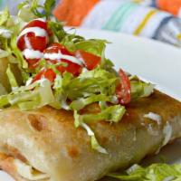 Chimichangas · Choice of filling with crispy fried flour tortilla stuffed with cheese, rice, beans, topped ...