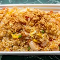 Thai Seafood Fried Rice · Seafood fried rice dish offers shrimp, scallop, crab meat, green peas with thai sauce, top w...