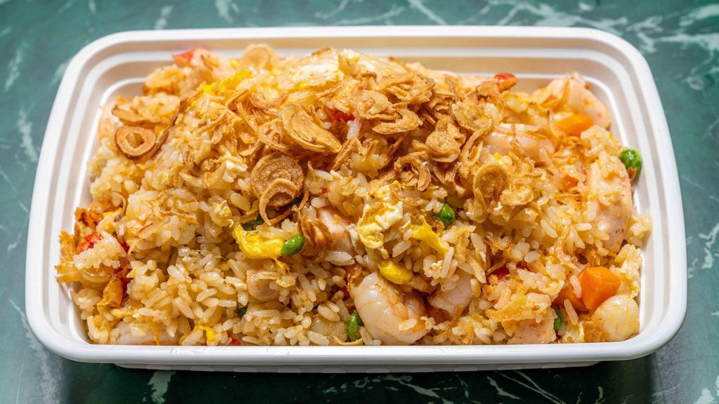Thai Seafood Fried Rice · Seafood fried rice dish offers shrimp, scallop, crab meat, green peas with thai sauce, top with fried shallots.