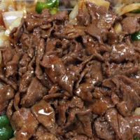 Pepper Steak With Onions · With white rice.