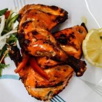 Tandoori Chicken · Leg Pieces Of Chicken Marinated In Yogurt and Spices Then Roasted In A Hot Tandoor Oven.