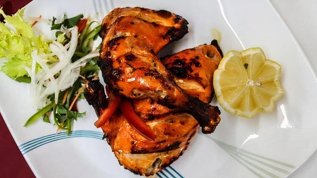 Tandoori Chicken · Leg Pieces Of Chicken Marinated In Yogurt and Spices Then Roasted In A Hot Tandoor Oven.