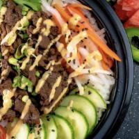 Beef & Chicken · Pepper beef, teriyaki chicken, mixed greens, cucumber, corn, sweet onion, and ginger dressing.