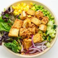 Veggie Bowl · Tofu, mixed greens, sweet onion, corn, cucumber, edamame, ginger dressing, and crispy onion.