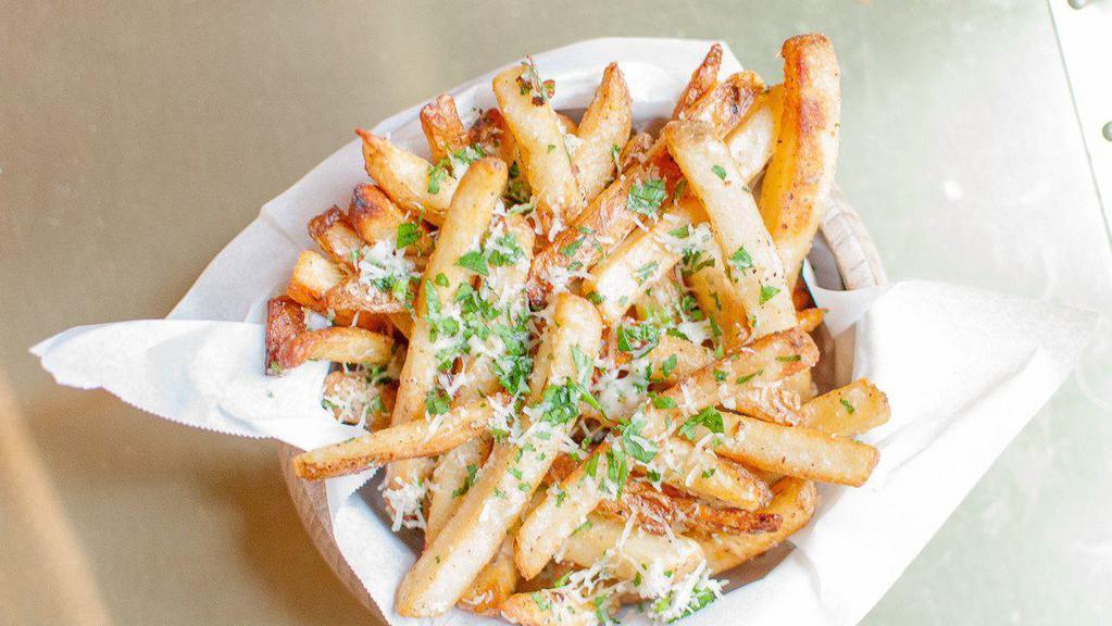 Truffle Fries · Ultimate crispy fries tossed with white truffle oil 5 months aged Parmesan cheese and parsley. Gluten free.