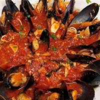 Mussels Marinara · Homemade marinara sauce, chili flakes, fresh basil. Wild organic PEI mussels served with fri...