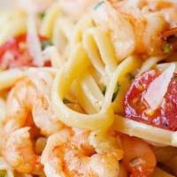 Linguini Shrimp Scampi · Marinated wild gulf shrimps, thyme, garlic, butter, white wine lemon sauce. Topped with 5 mo...