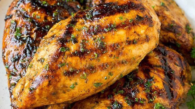Organic Chicken Breast · Marinated with thyme, rosemary, lemon hints, garlic and parsley. Gluten free.