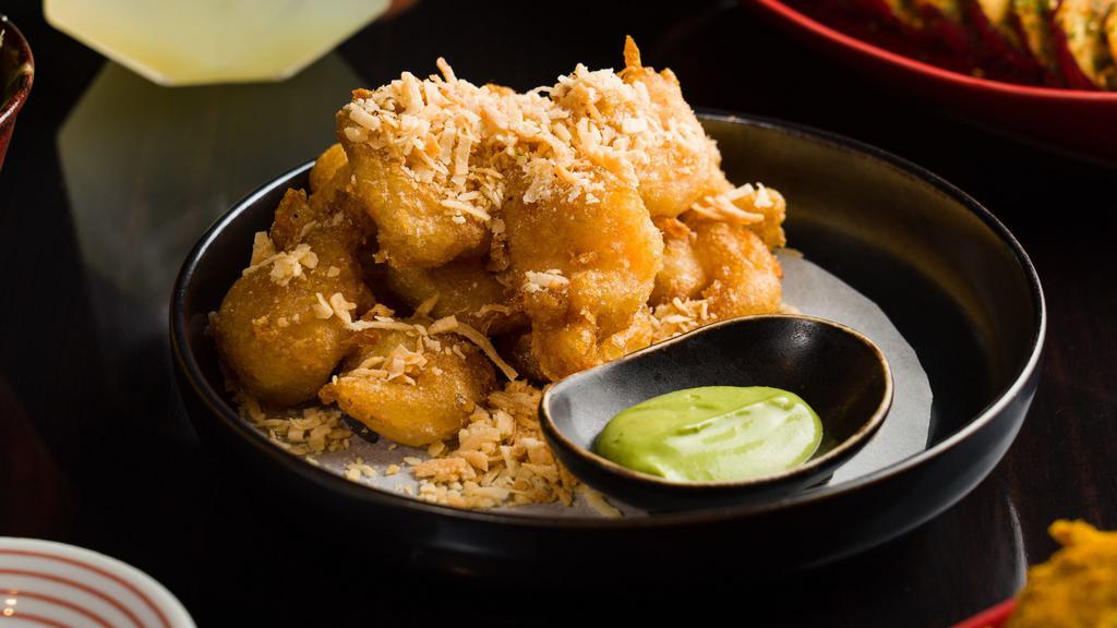 Coconut Rock Shrimp · Tempura Fried Rock Shrimp, Coconut Flakes, Served with Green Curry Coconut Sauce
