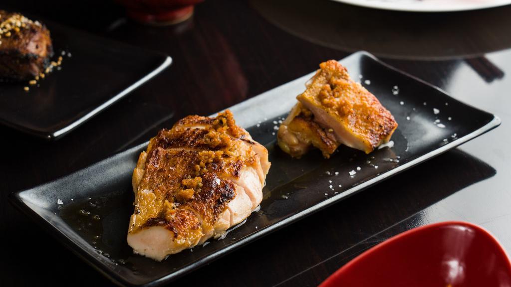 Garlic Chicken · Boneless breast and thigh with garlic confit. Served with a side of Yuzu Chimichurri sauce.