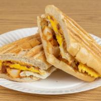 Hungry Man Hero Sandwich · 3 Eggs, Cheese, Home Fries, & Choice of Meat on toasted Hero.