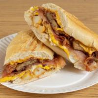 Hungriest Man · 3 Eggs, Cheese, Home Fries, Bacon, Sausage, Turkey, and Ham on a Toasted Hero