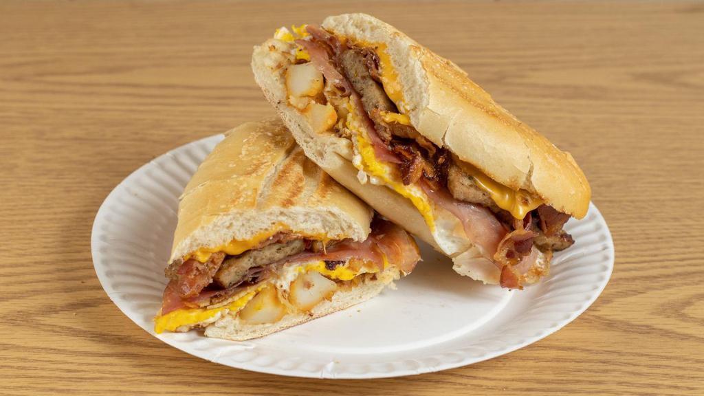 Hungriest Man · 3 Eggs, Cheese, Home Fries, Bacon, Sausage, Turkey, and Ham on a Toasted Hero