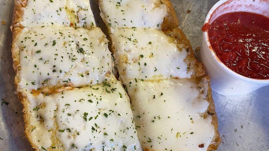 Garlic Bread · Bread, topped with garlic and olive oil or butter, herb seasoning, baked to perfection. Melts in your mouth and arouses the taste buds.