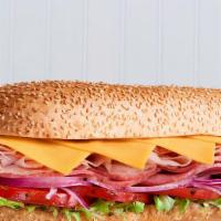 Ham & Cheese Hero Sub Sandwich · Delicious Sub sandwich made with Ham & Cheese. Served with a side of Potato chips, pickles, ...
