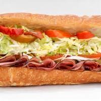 Turkey Hero Sub Sandwich · Delicious Sub sandwich made with Turkey. Served with a side of Potato chips, pickles, and co...