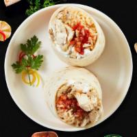 Chicken Burrito · Grilled chicken topped with sour cream, salsa, cheese, and spanish rice wrapped in a warm to...