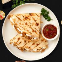 Steak Quesadilla · Grilled sirloin steak wrapped with cheese in a grilled tortilla.