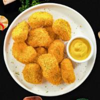 Chicken Nuggets · (12 pieces) Bite sized nuggets of chicken breaded and fried until golden brown.