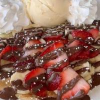 Nutella, Strawberry & Banana Crêpe · Fresh strawberry, banana slices and rich Nutella® top off this crepe.  Comes topped with whi...