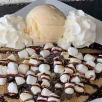 S'Mores Crêpe · A campfire-inspired crepe covered in chocolate chips, graham cracker crumbs, mini marshmallo...