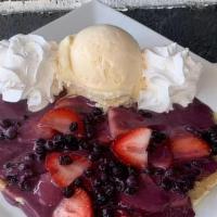 Berry Sauce Crepe · Sweet and tart, this crepe comes with fresh strawberries and blueberries and is covered in o...