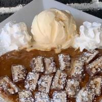 Liquid Gold Crepe · A golden combination of our Dulce de Leche sauce and pieces of Snickers®.  Includes whipped ...